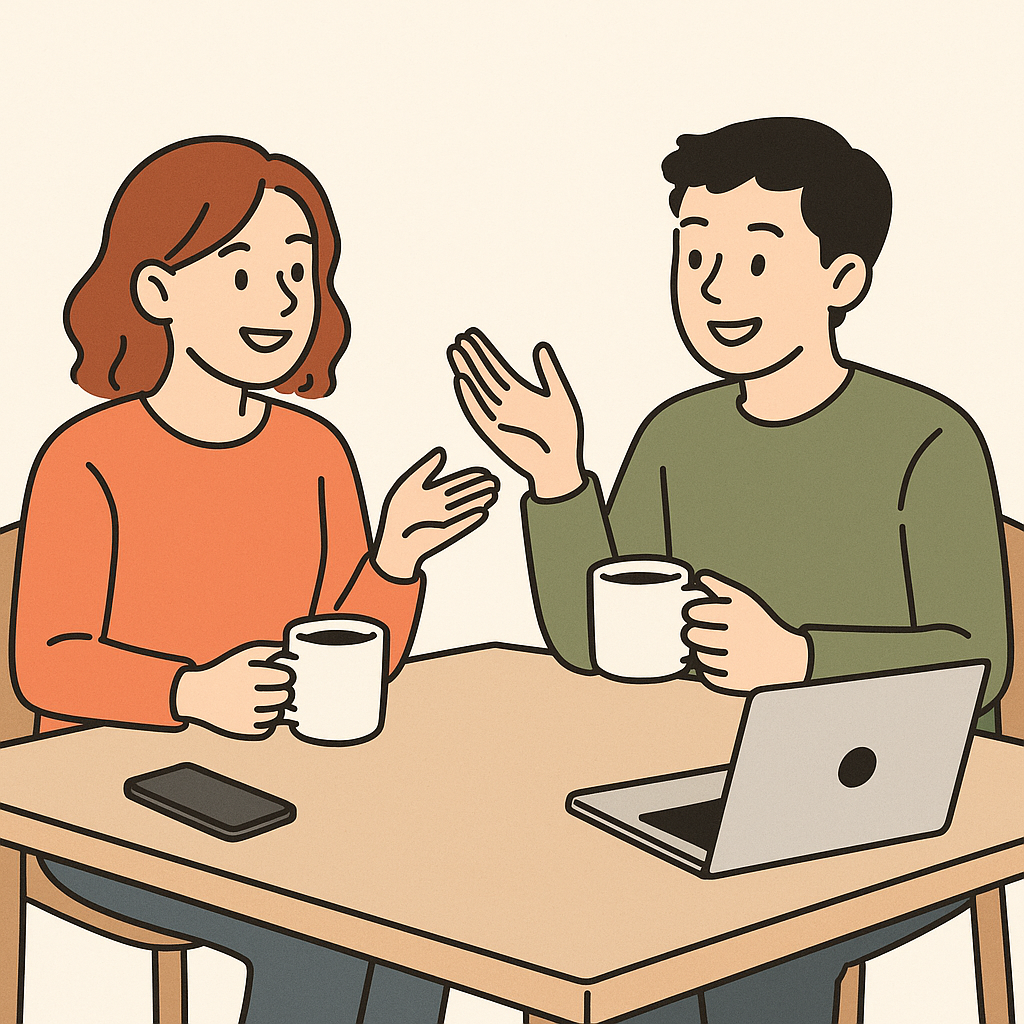 two friends having a relaxed conversation over coffee, with a phone and laptop on the table, friendly atmosphere
