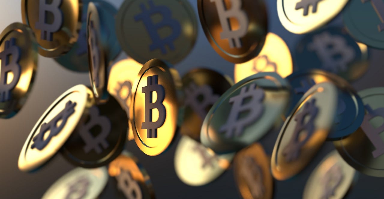 Diverse group of professionals discussing 401(k) retirement options with a digital tablet displaying Bitcoin and cryptocurrency icons in a modern office setting