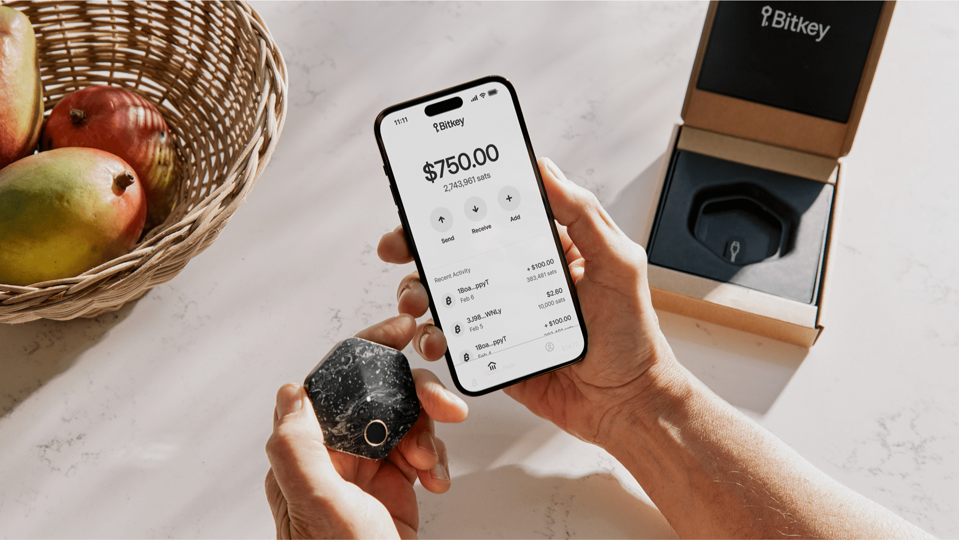 A hardware wallet next to a smartphone displaying a crypto wallet app, symbolizing secure self-custody of digital assets in 2025.